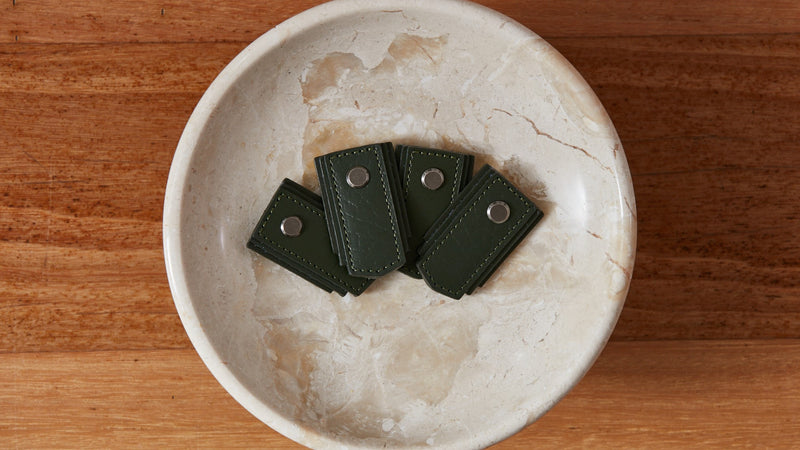 Khaki leather pull handle from Sagitine, featuring a sleek design for easy grip