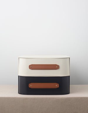 Tan leather handle by Sagitine, featuring a sleek design and sturdy construction.