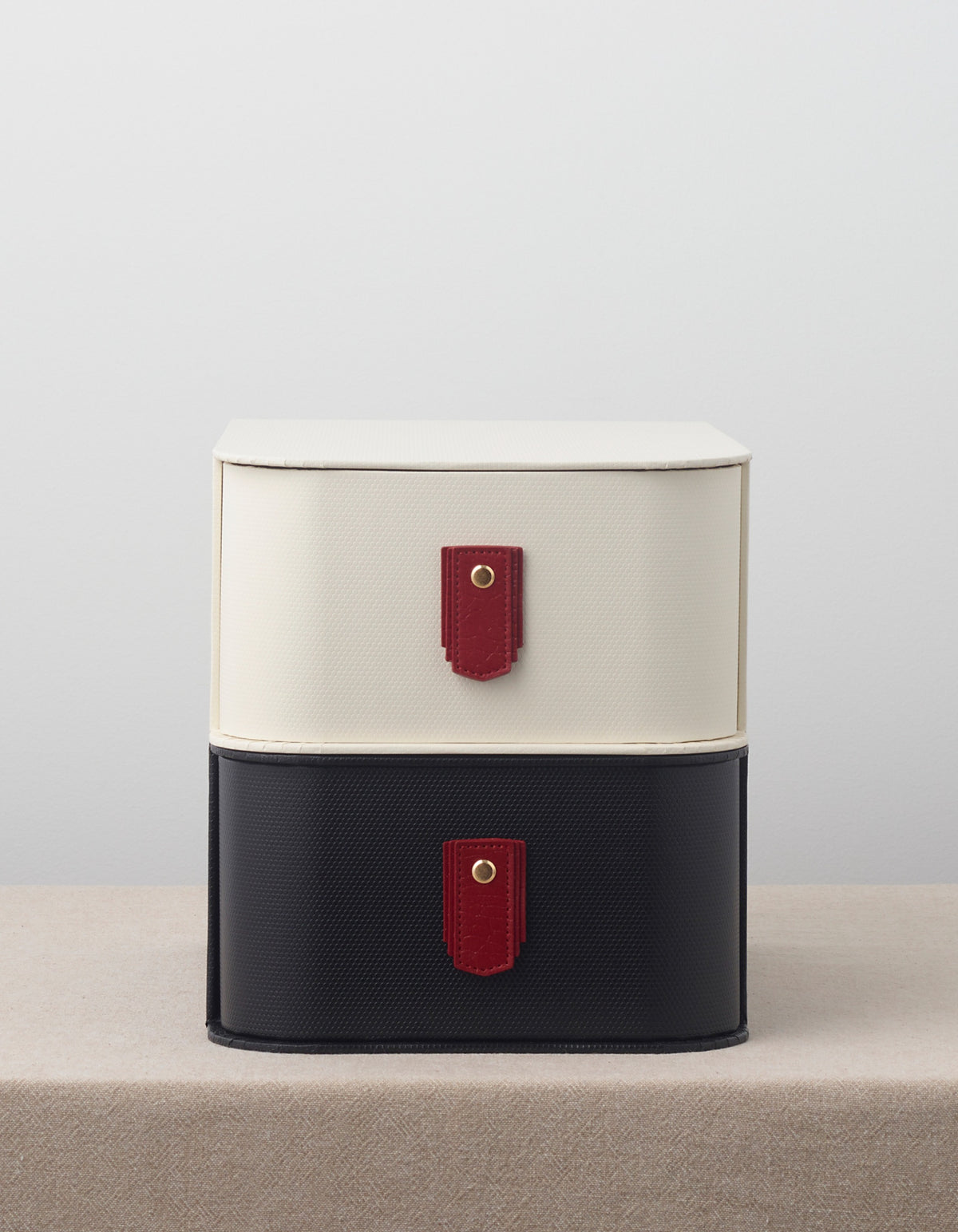 Red leather pull from Sagitine with a sleek, minimalist design