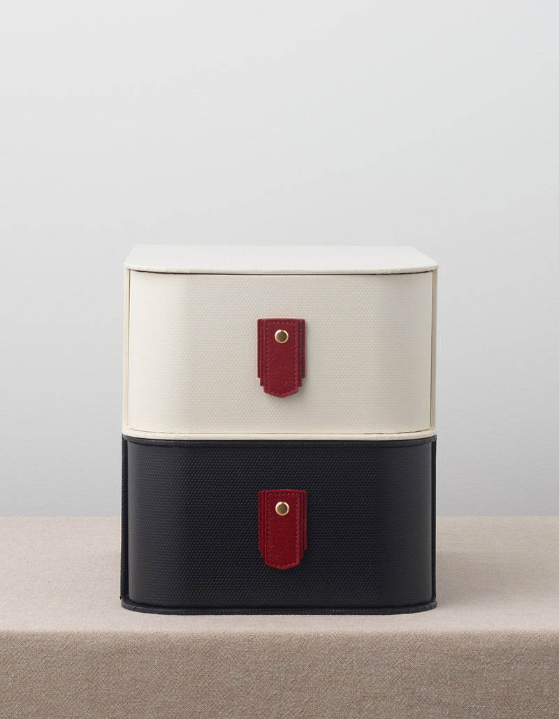 Red leather pull from Sagitine with a sleek, minimalist design