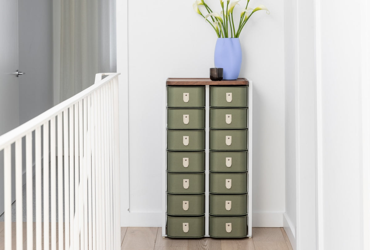 Olive 14 box stand with white legs by SAGITINE, featuring a sleek design for stylish storage.