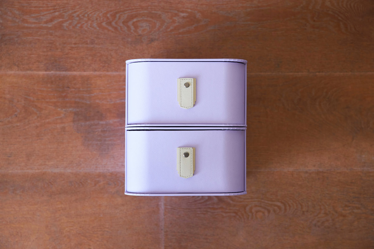Lilac 20 Box Stand with white frame and cream handles by SAGITINE, perfect for limited-edition storage.