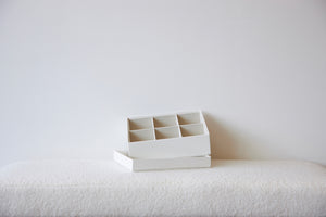 White organizer insert box with six compartments for belts by SAGITINE.