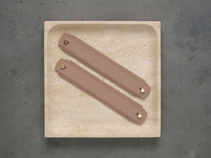 Blush leather handle from Sagitine featuring a smooth finish and stylish design