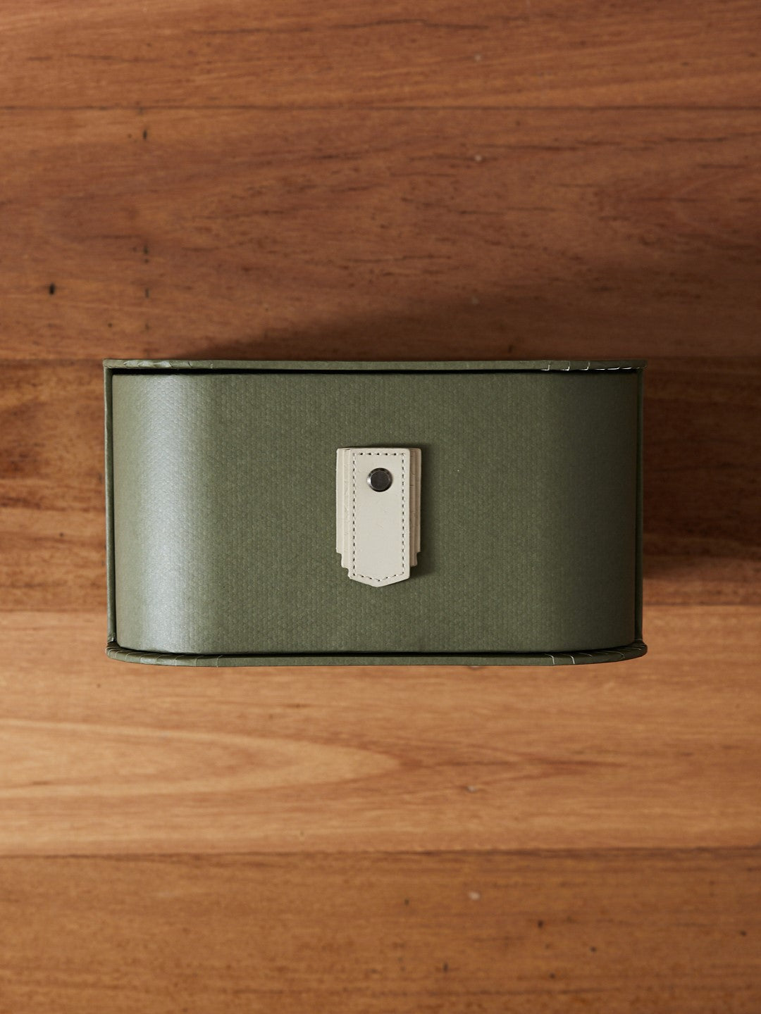 Olive box storage stand with cream handles and black frame by Sagitine, designed for organizing with style.
