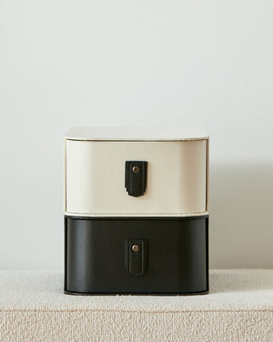 Black leather pull handle by Sagitine, featuring a sleek design and sturdy construction.